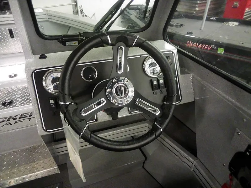 Slide: The Image of 2024 Smoker Craft Phantom 18 X2 boat dashboard with steering wheel and gauges. - 20
