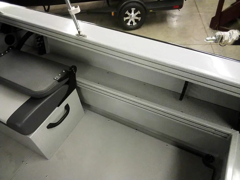 Slide: The Image of 2024 Smoker Craft Phantom 18 X2 interior with seating and storage features. - 23