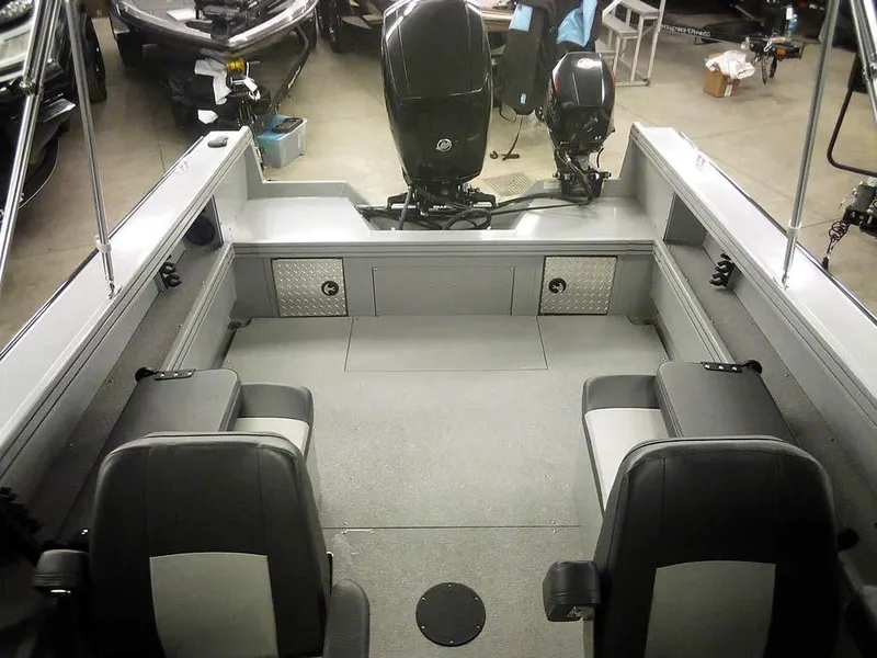 Slide: The Image of 2024 Smoker Craft Phantom 18 X2 boat interior with dual motors and seating. - 25