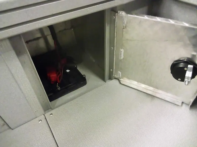 Slide: The Image of 2024 Smoker Craft Phantom 18 X2 storage compartment with battery inside. - 26