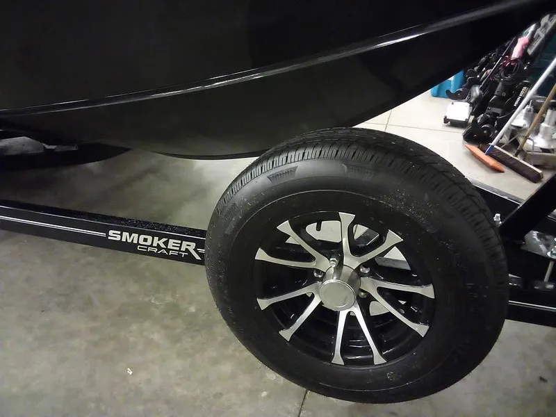 Slide: The Image of 2024 Smoker Craft Phantom 18 X2 trailer wheel and tire detail. - 30