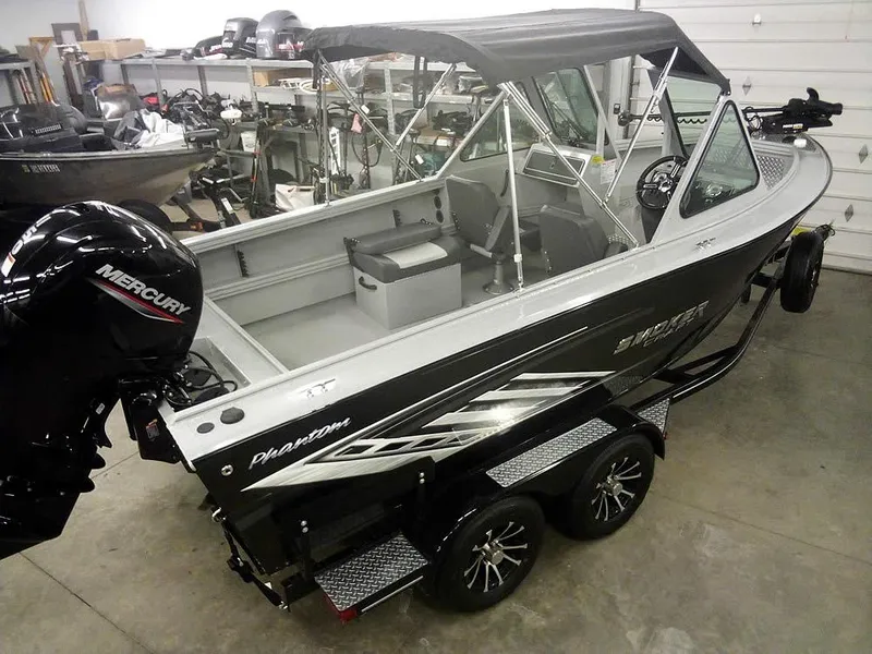 Slide: The Image of 2024 Smoker Craft Phantom 18 X2 boat with Mercury engine in a showroom. - 31