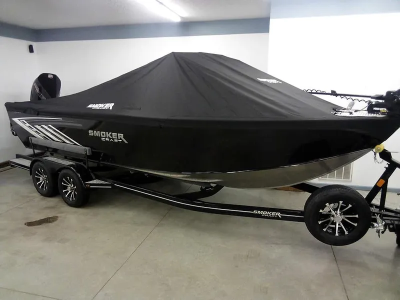 Slide: The Image of 2024 Smoker Craft Phantom 18 X2 boat with cover on trailer in garage. - 32