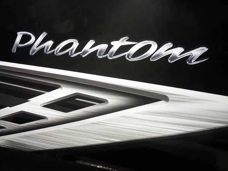Slide: The Image of 2024 Smoker Craft Phantom 18 X2 logo on sleek black surface. - 7