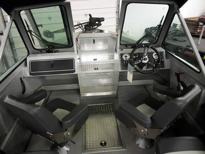 Slide: The Image of 2024 Smoker Craft Phantom 18 X2 boat interior with steering wheel and seating. - 9