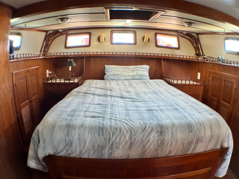 Slide: The Image of Cozy cabin interior of 1981 Island Trader 46 with wooden furnishings and a comfortable bed. - 15