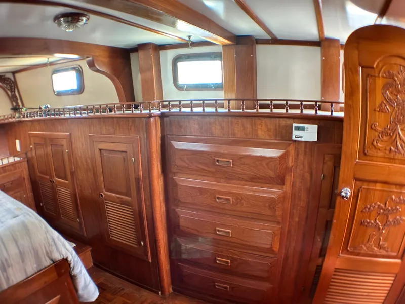 Slide: The Image of Interior of 1981 Island Trader 46 yacht with wooden cabinetry and drawers. - 16