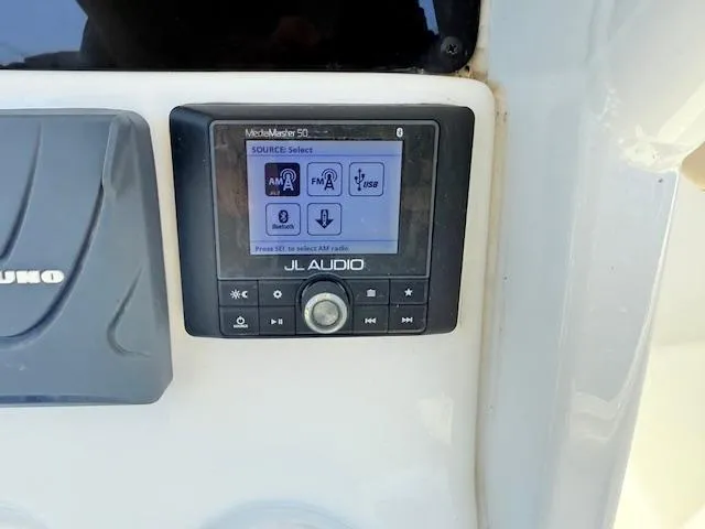 Slide: The Image of JL Audio system on 2022 Tidewater 256 CC Adventure boat dashboard. - 12