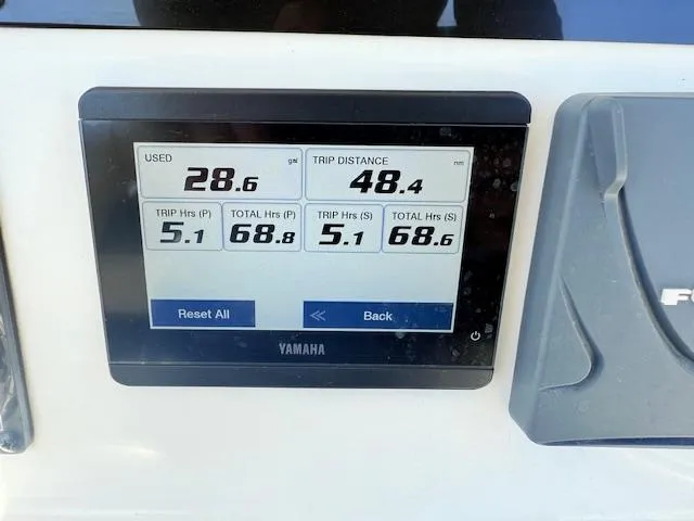 Slide: The Image of Yamaha display showing fuel usage and trip data on 2022 Tidewater 256 CC Adventure. - 13