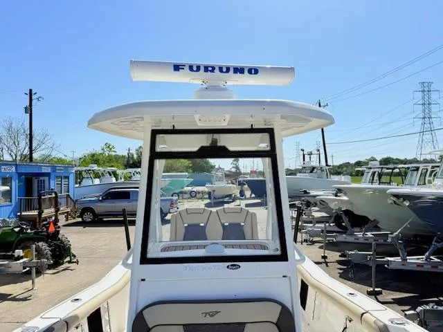 Slide: The Image of 2022 Tidewater 256 CC Adventure boat with Furuno radar, docked in a marina. - 17