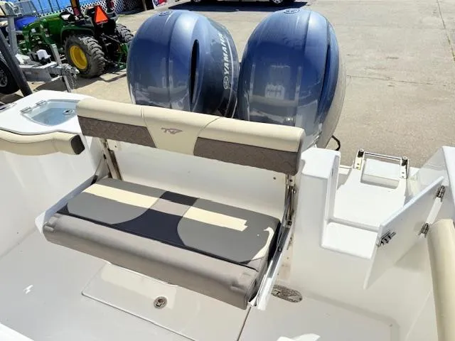 Slide: The Image of 2022 Tidewater 256 CC Adventure boat with dual Yamaha engines and rear seating. - 7