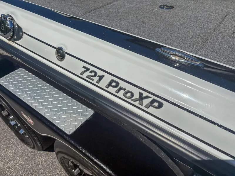 Slide: The Image of 2023 Phoenix 721 ProXP boat detail with logo and textured step. - 11
