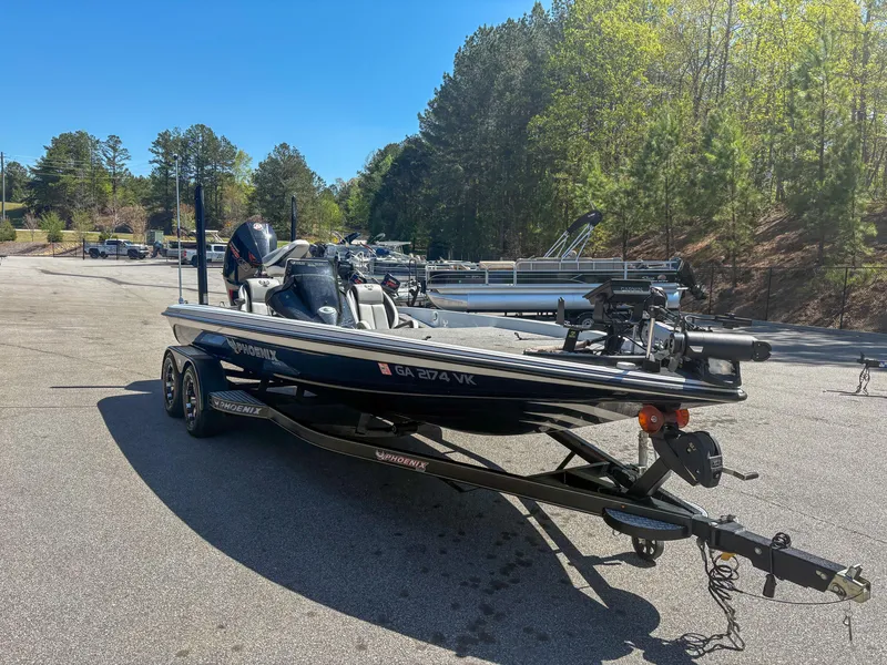 Slide: The Image of 2023 Phoenix 721 ProXP boat on trailer in sunny outdoor setting. - 13