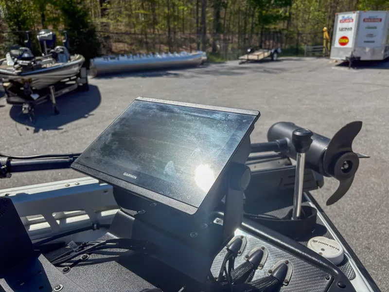 Slide: The Image of 2023 Phoenix 721 ProXP boat with Garmin display and trolling motor in a sunny outdoor setting. - 3