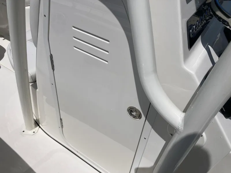 Slide: The Image of 2025 Key West 239FS boat console detail with sleek white finish and sturdy railing. - 14
