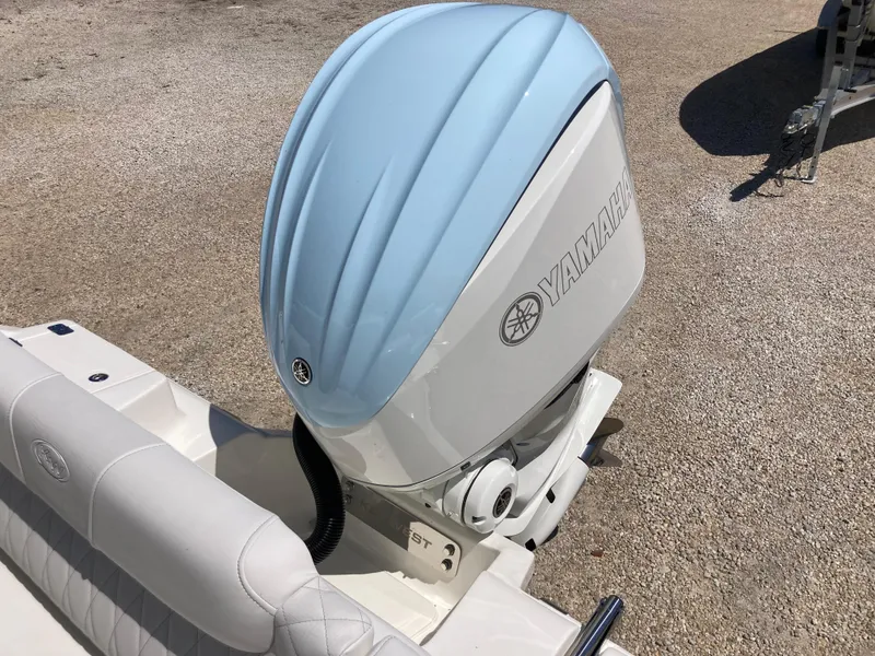 Slide: The Image of 2025 Key West 239FS boat with Yamaha outboard motor, featuring light blue engine cover. - 18