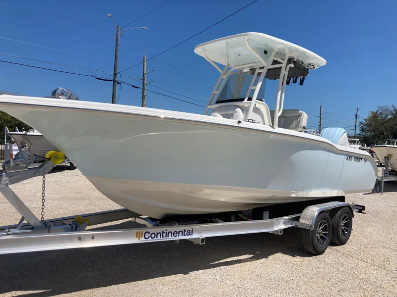 Slide: The Image of 2025 Key West 239FS boat on Continental trailer, parked outdoors. - 5