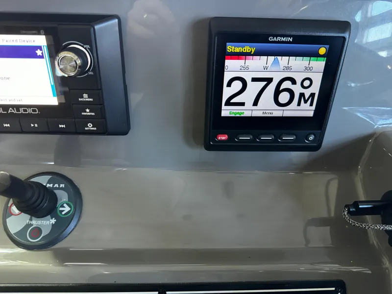 Slide: The Image of Control panel of a 2018 Pursuit OS 355 Offshore with Garmin navigation display. - 21