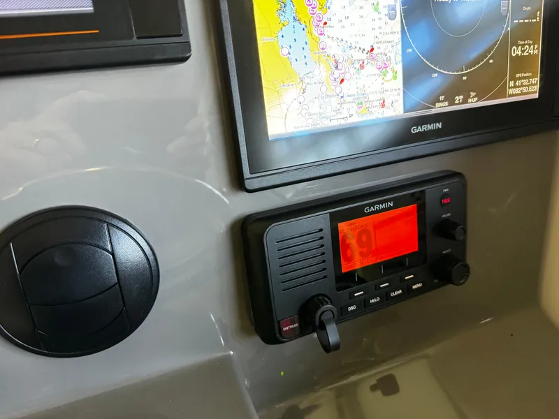 Slide: The Image of Garmin navigation system on 2018 Pursuit OS 355 Offshore boat dashboard. - 22