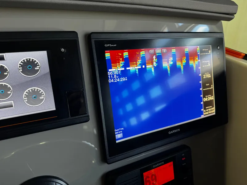Slide: The Image of 2018 Pursuit OS 355 Offshore dashboard with Garmin GPS and sonar display. - 23