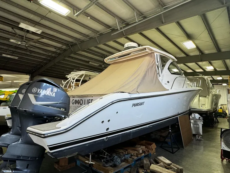 Slide: The Image of 2018 Pursuit OS 355 Offshore boat in storage with Yamaha engines. - 6