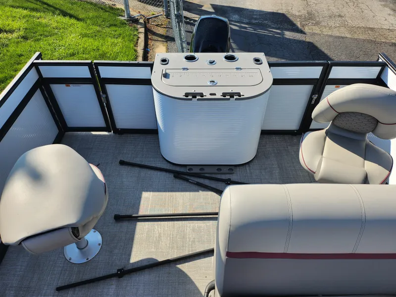 Slide: The Image of 2024 Qwest Angler Qwest XRE boat interior with seating and control panel. - 16