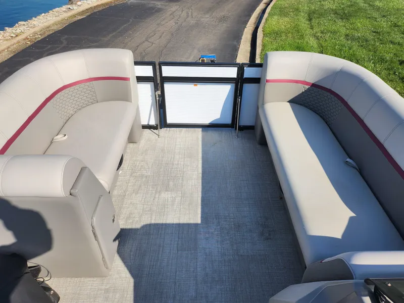 Slide: The Image of 2024 Qwest Angler Qwest XRE boat interior with gray seating and red accents. - 23