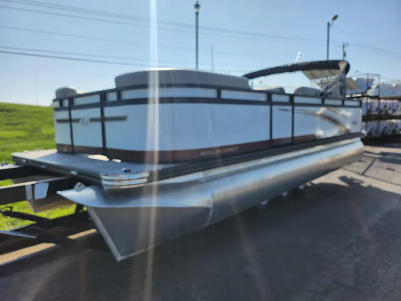 Slide: The Image of 2024 Qwest Angler Qwest XRE pontoon boat on trailer, side view. - 6