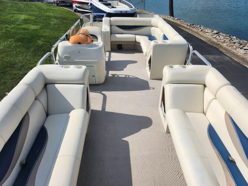 Slide: The Image of 2007 Odyssey Pontoons 222C with spacious seating on a calm waterfront. - 10