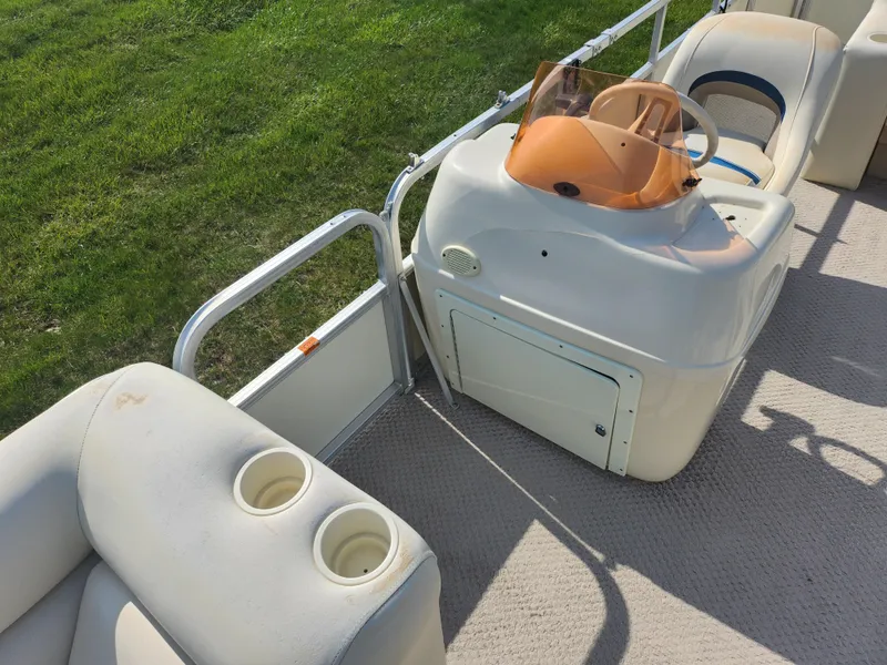 Slide: The Image of 2007 Odyssey Pontoons 222C interior with helm and seating area. - 12