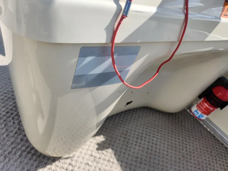 Slide: The Image of 2007 Odyssey Pontoons 222C interior with safety equipment and red cord. - 19