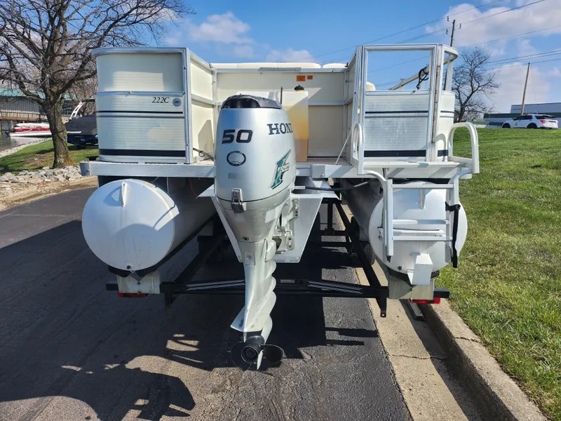 Slide: The Image of 2007 Odyssey Pontoons 222C with Honda 50 outboard motor on a trailer. - 2