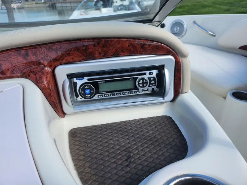 Slide: The Image of Dashboard of a 2013 Tahoe Q7i boat featuring a stereo system. - 17