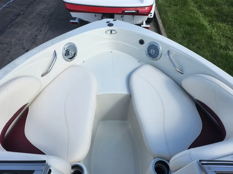 Slide: The Image of 2013 Tahoe Q7i boat interior with white seating and built-in speakers. - 18