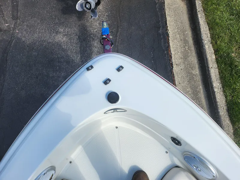 Slide: The Image of Bow view of a 2013 Tahoe Q7i boat on a trailer. - 19