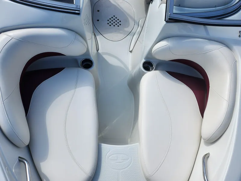 Slide: The Image of Luxurious white seating in a 2013 Tahoe Q7i boat interior. - 20