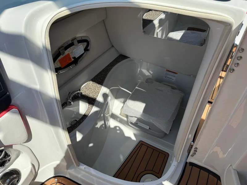 Slide: The Image of Interior of 2025 Crownline Eclipse E235 boat, featuring compact cabin space. - 10