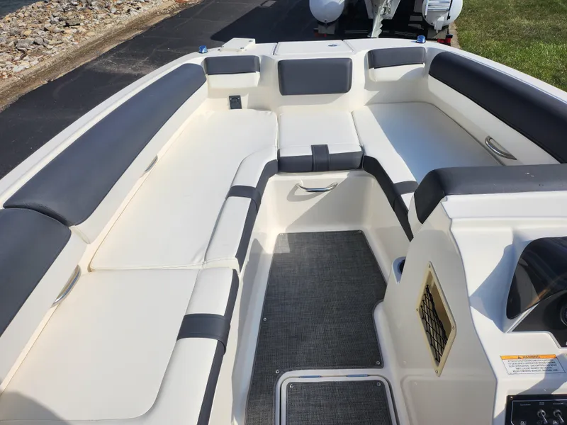 Slide: The Image of 2021 Bayliner DX 2000 boat interior with spacious seating and modern design. - 17