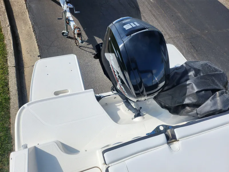 Slide: The Image of 2021 Bayliner DX 2000 boat with outboard motor on trailer, viewed from above. - 25