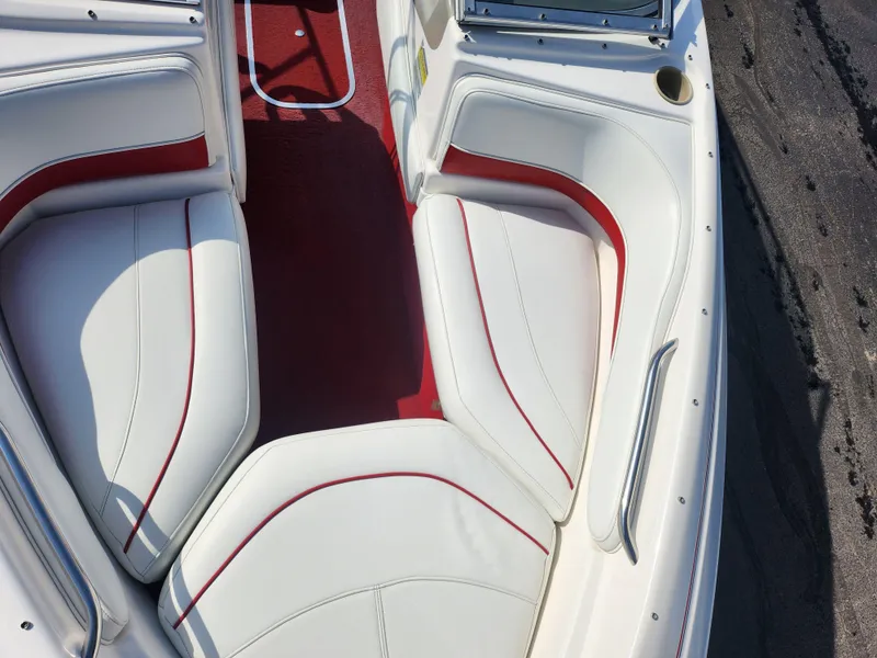 Slide: The Image of 1997 Bayliner 2050 Capri SS boat interior with white and red seating. - 17