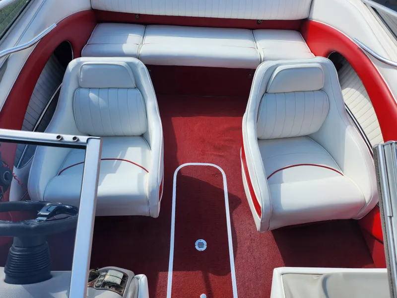 Slide: The Image of 1997 Bayliner 2050 Capri SS interior with red carpet and white seating. - 19