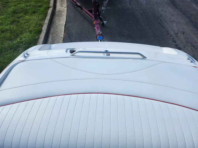 Slide: The Image of 1997 Bayliner 2050 Capri SS boat with white upholstery and trailer hitch. - 21