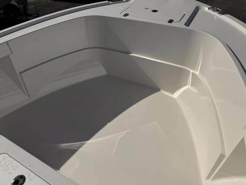 Slide: The Image of 2025 Parker 18SE Center Console boat interior, featuring a spacious, clean white deck. - 12