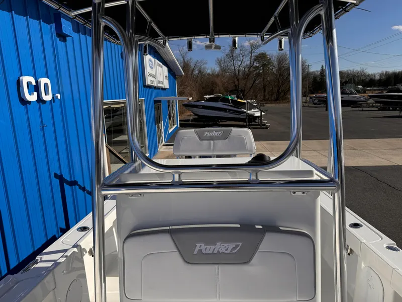 Slide: The Image of 2025 Parker 18SE Center Console boat at a dealership, featuring sleek design and modern amenities. - 13