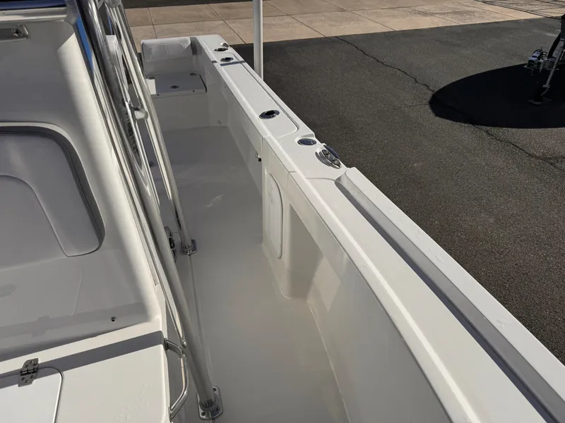 Slide: The Image of 2025 Parker 18SE Center Console boat interior, featuring sleek white design and spacious layout. - 15