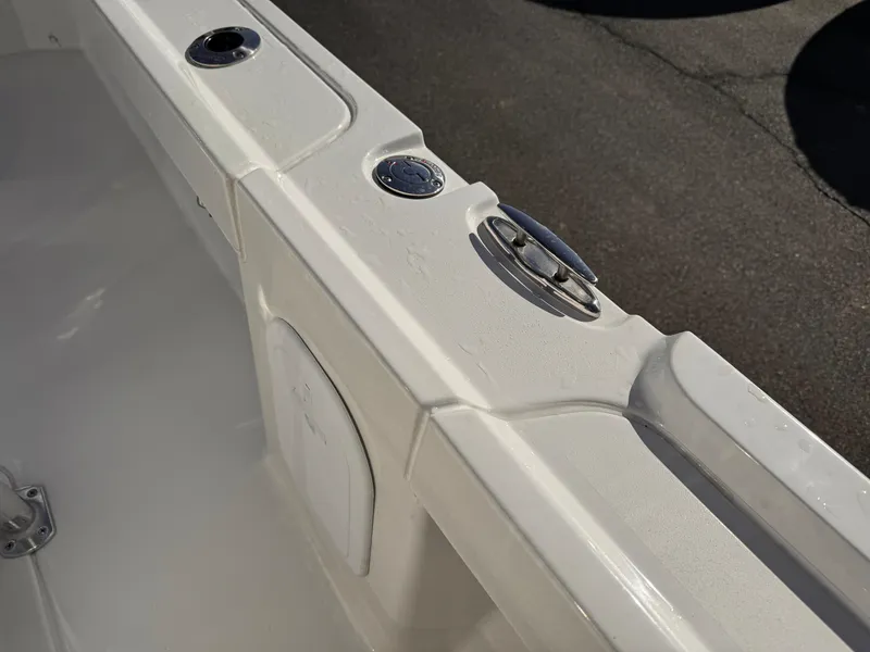 Slide: The Image of 2025 Parker 18SE Center Console boat detail, featuring sleek white deck and fittings. - 16