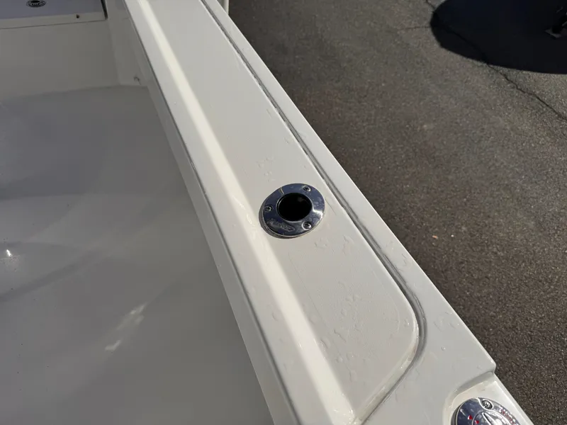Slide: The Image of 2025 Parker 18SE Center Console boat detail, featuring a rod holder on the deck. - 17