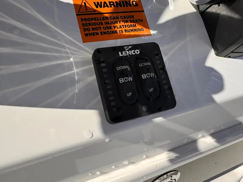 Slide: The Image of Control panel on 2025 Parker 18SE Center Console boat with warning label. - 19