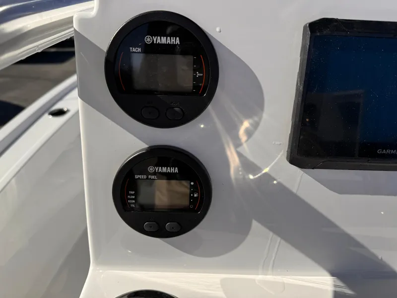 Slide: The Image of Dashboard of 2025 Parker 18SE Center Console with Yamaha gauges and Garmin display. - 21