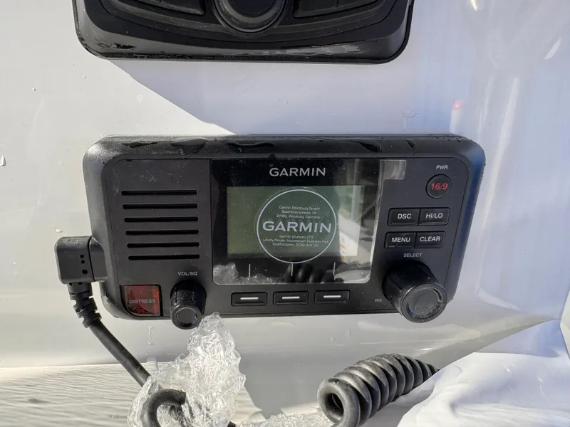 Slide: The Image of Garmin marine radio on 2025 Parker 18SE Center Console boat dashboard. - 22